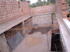 1st floor living room with hole in floor for stairs